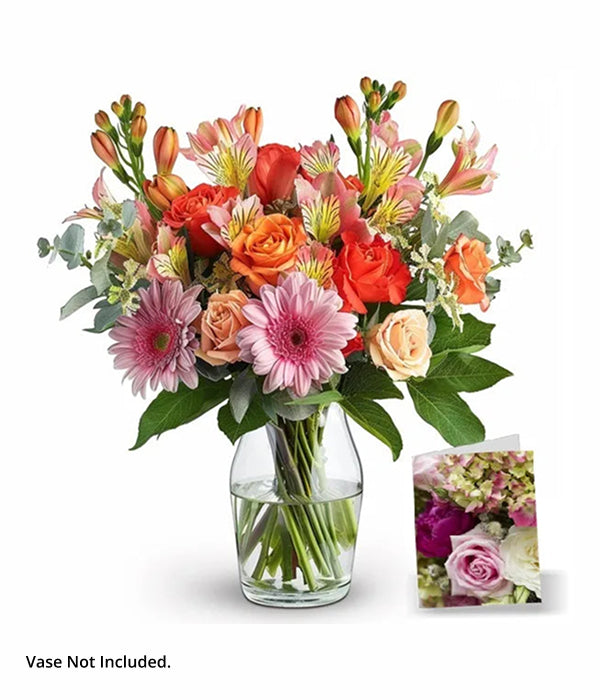 Colorful flower bouquet in a vase with card