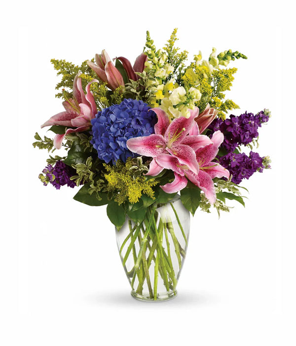 pink lilies, hydrangea, and mixed flowers.