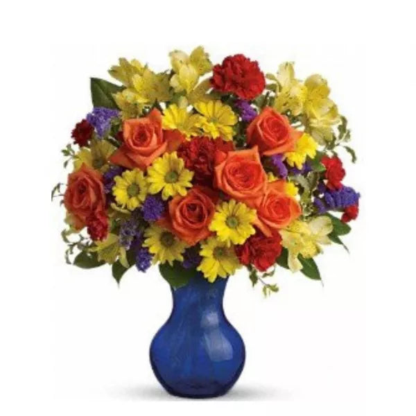 warm color flowers in a blue vase